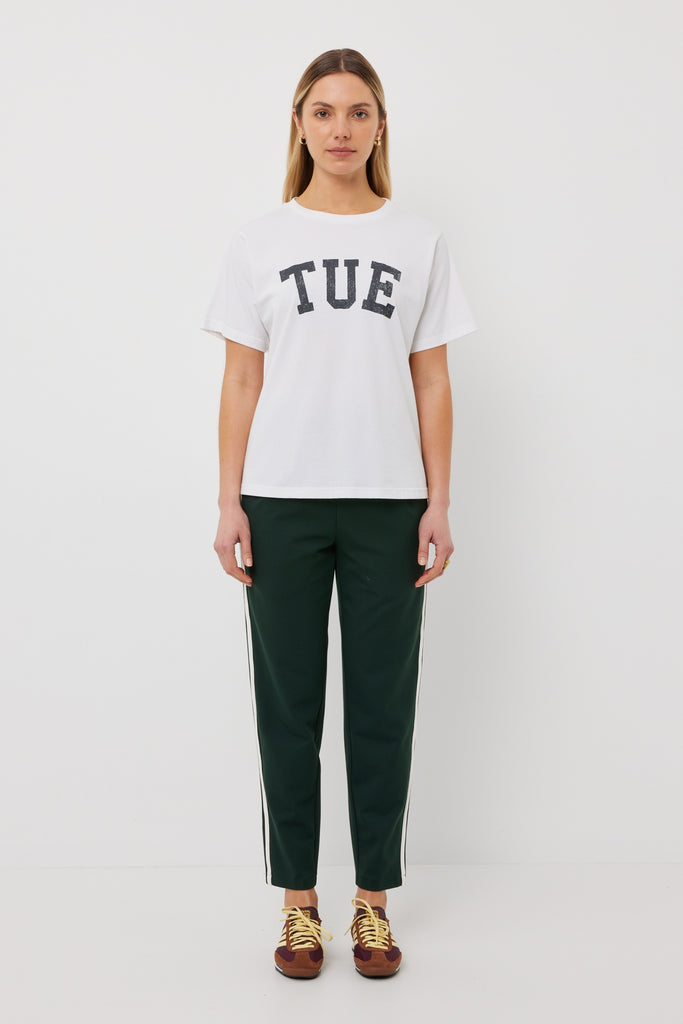 Women front on earing dark green colour with contrast white double stripe pants and white t