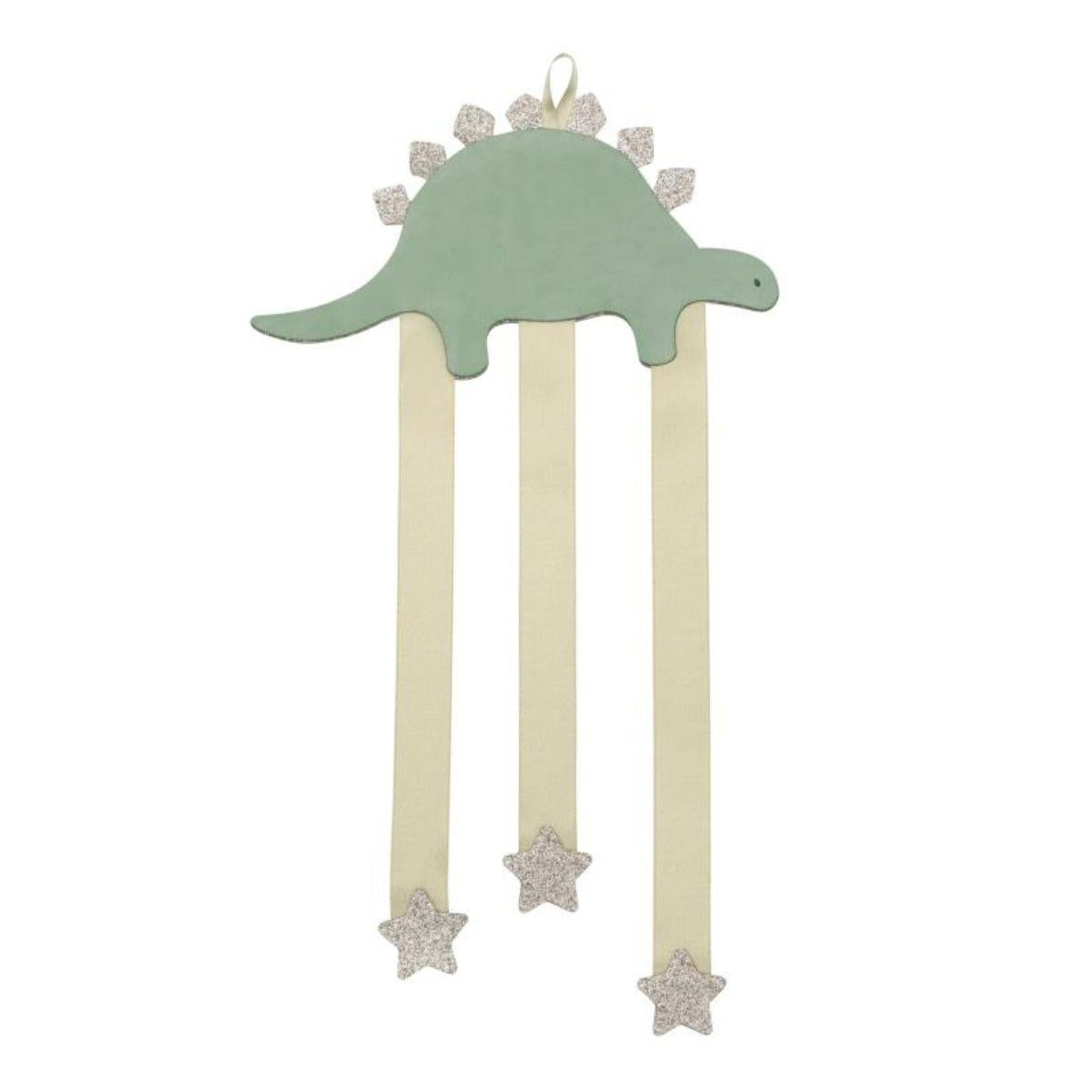 Decorative hanging with green top and beige ribbons on a white background