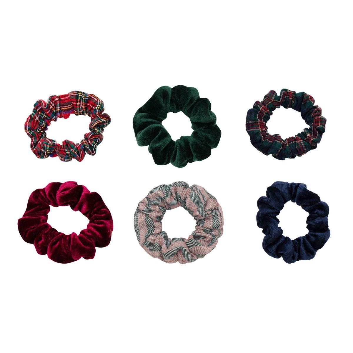 Set of six colorful scrunchies on a white background
