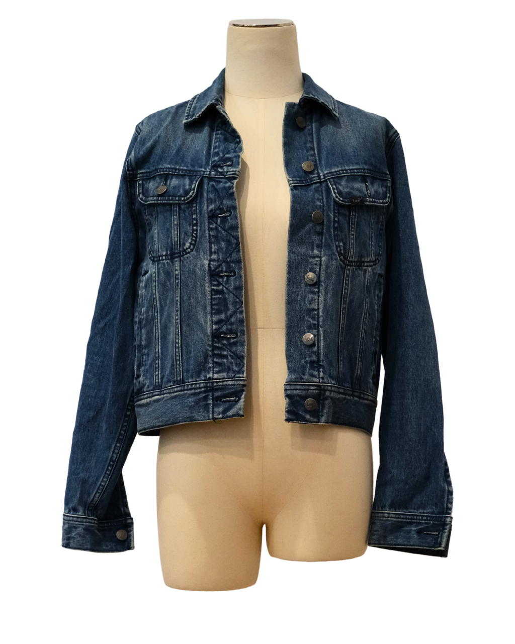Blue denim jacket on a mannequin against a white background