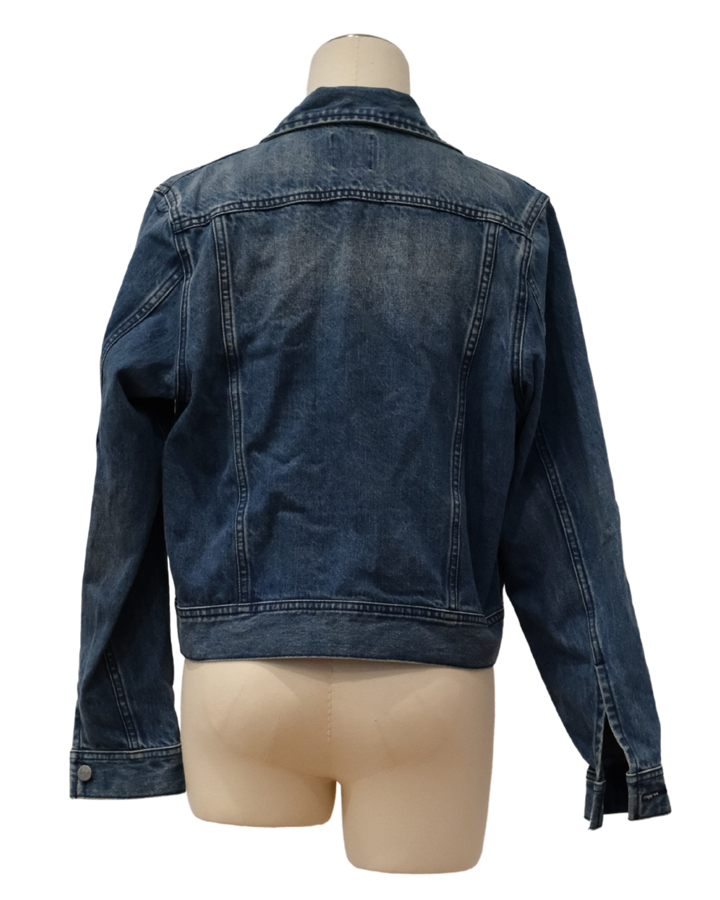 Blue denim jacket on a mannequin against a white background