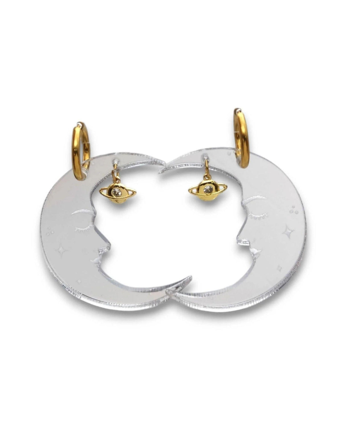 A pair of gold and silver celestial hoop earrings with small gold planet charms, displayed on a clean white background.