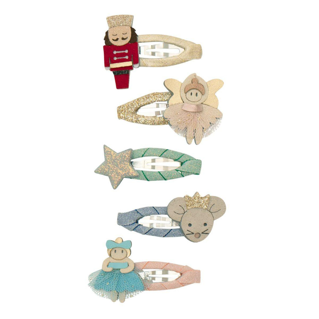 Set of decorative hair clips with fairy, star, and mouse designs on a white background