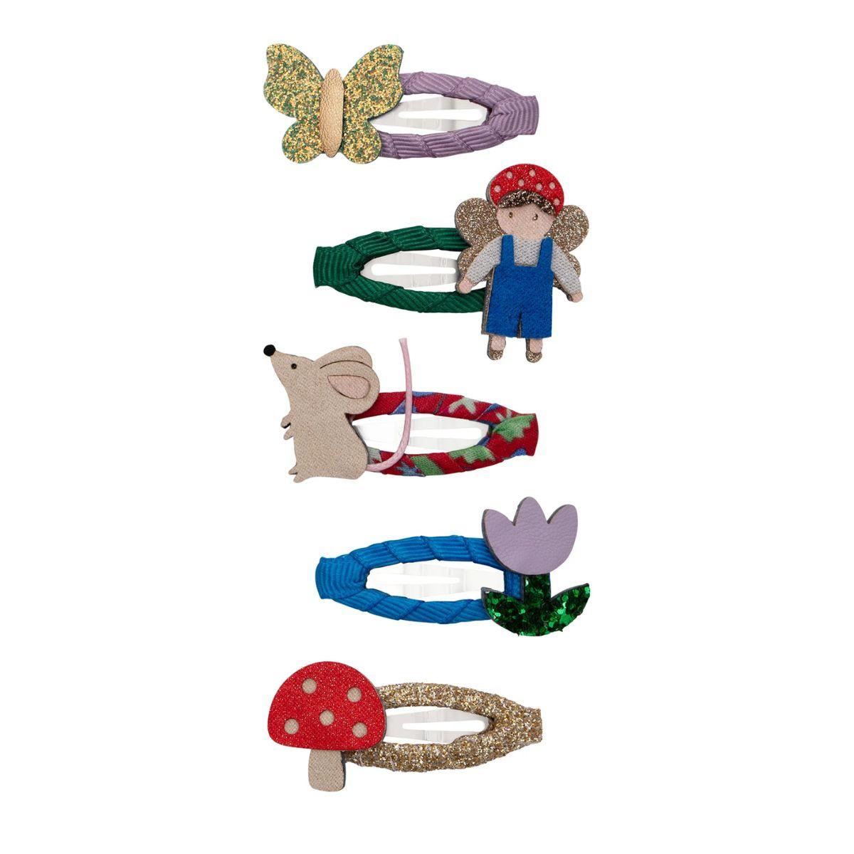 Set of colorful hair accessories with fairy, mouse, mushroom, and flower designs on a white background.