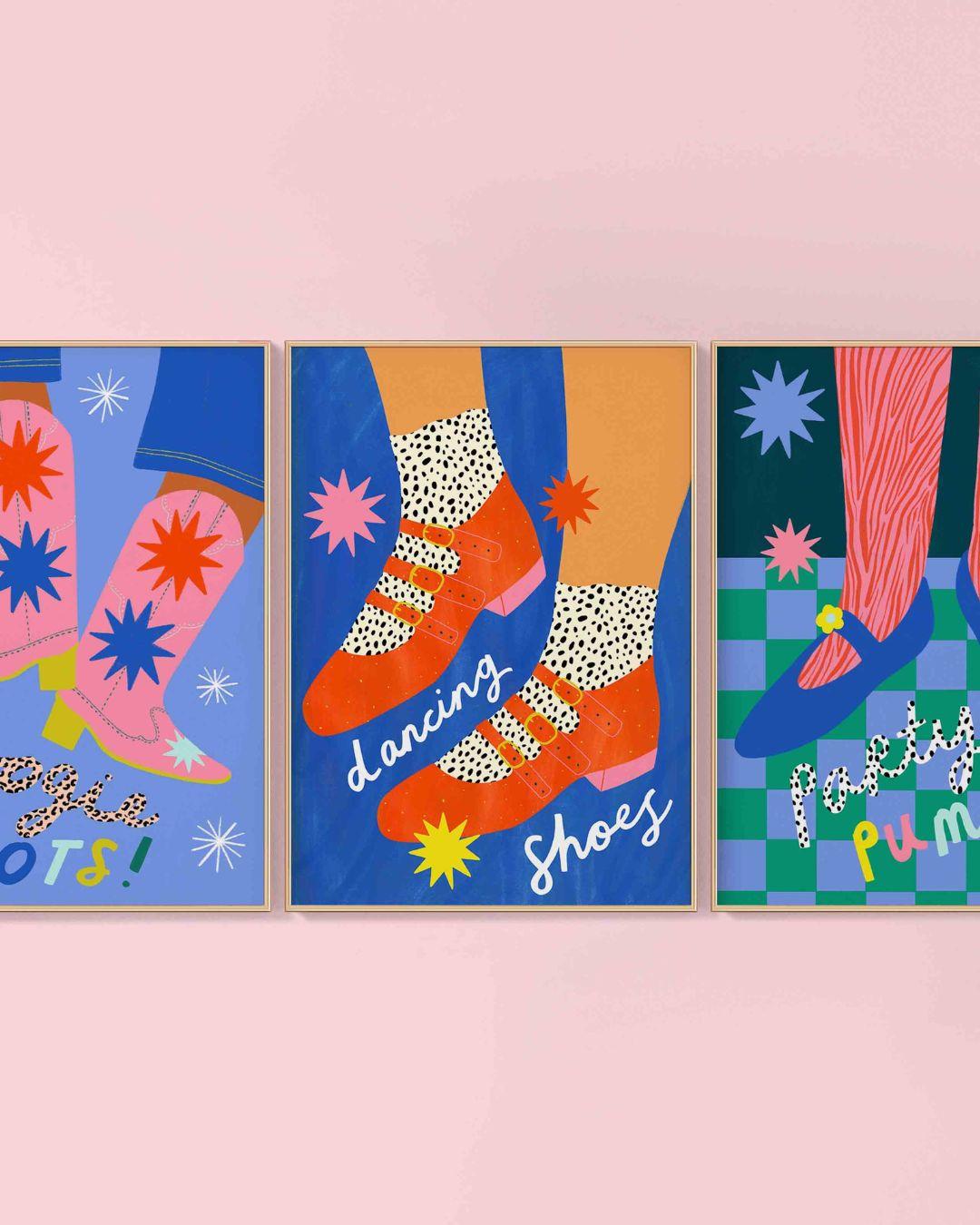 Three colorful framed artworks featuring feet in shoes on a pink background