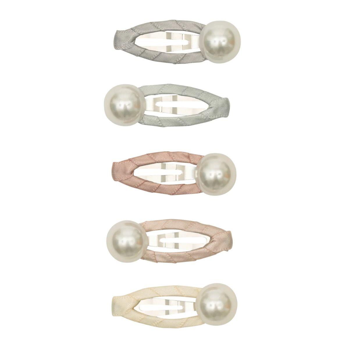Set of four pearl hair clips in different colors on a white background