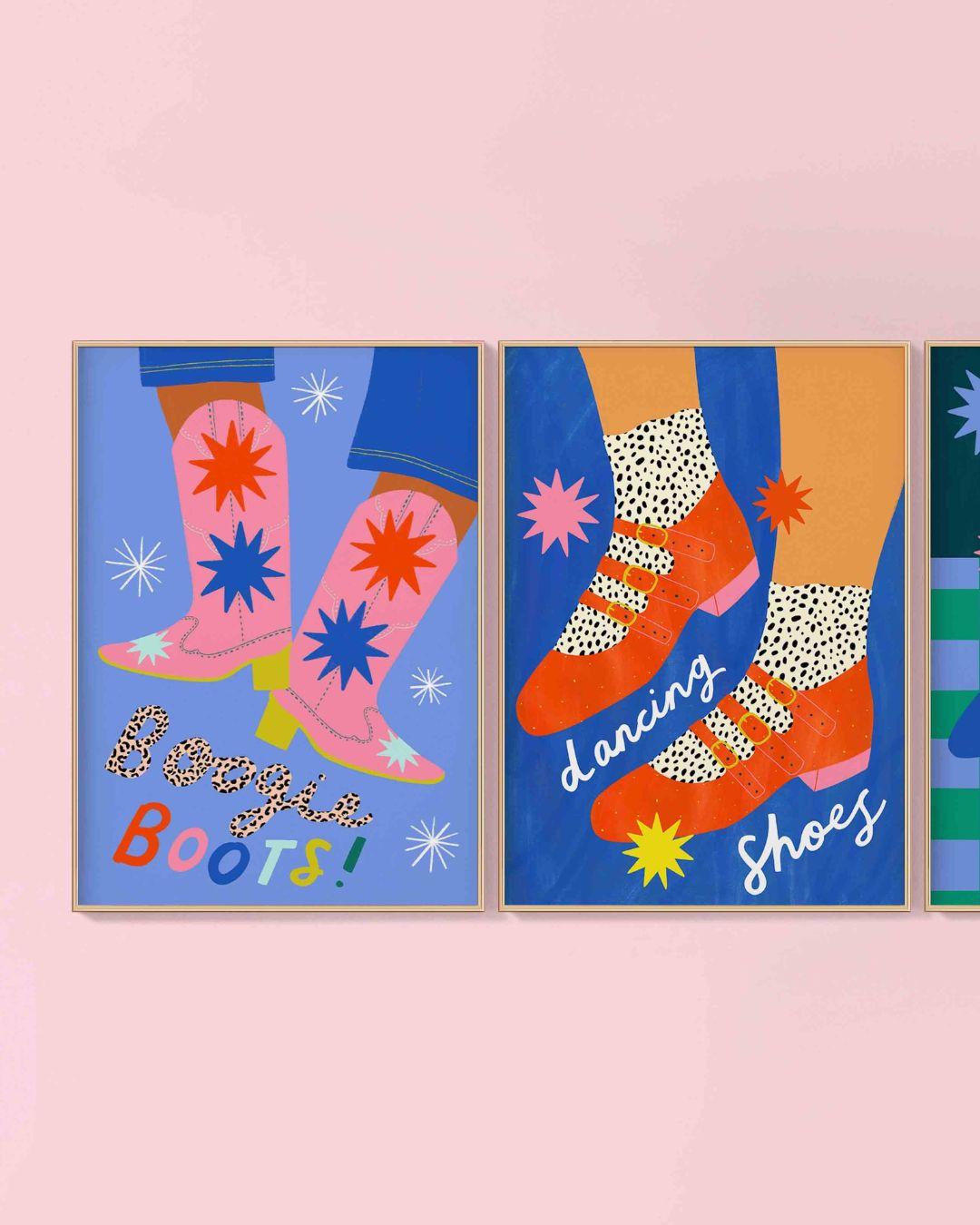 Three colorful posters of feet in boots and shoes on a pink wall.