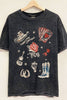 Black t-shirt with cowboy-themed graphics on a wooden hanger against a white background