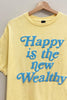 Yellow t-shirt with blue text 'Happy is the new Wealthy' on a hanger against a gray background