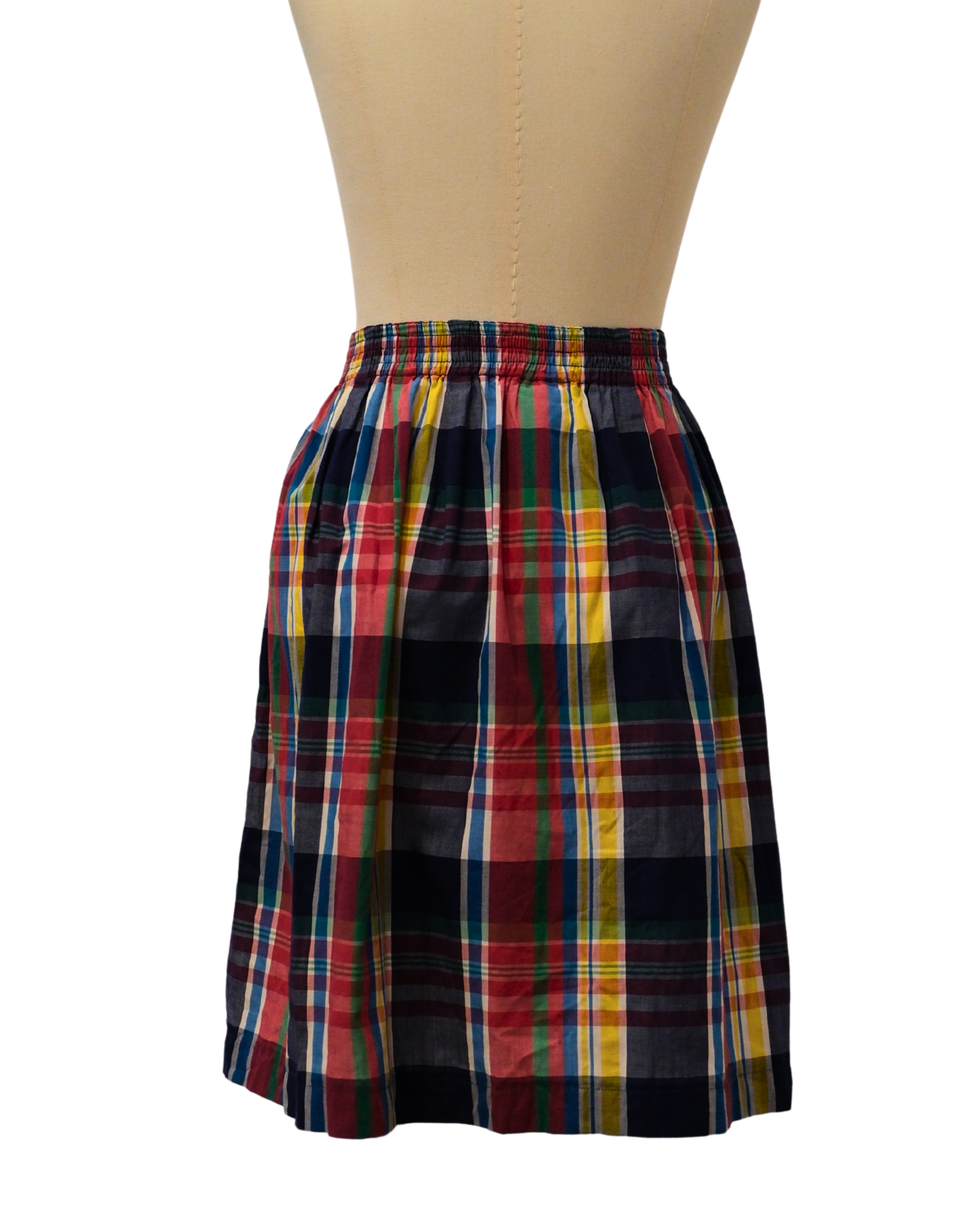 Colorful plaid skirt on a mannequin against a white background