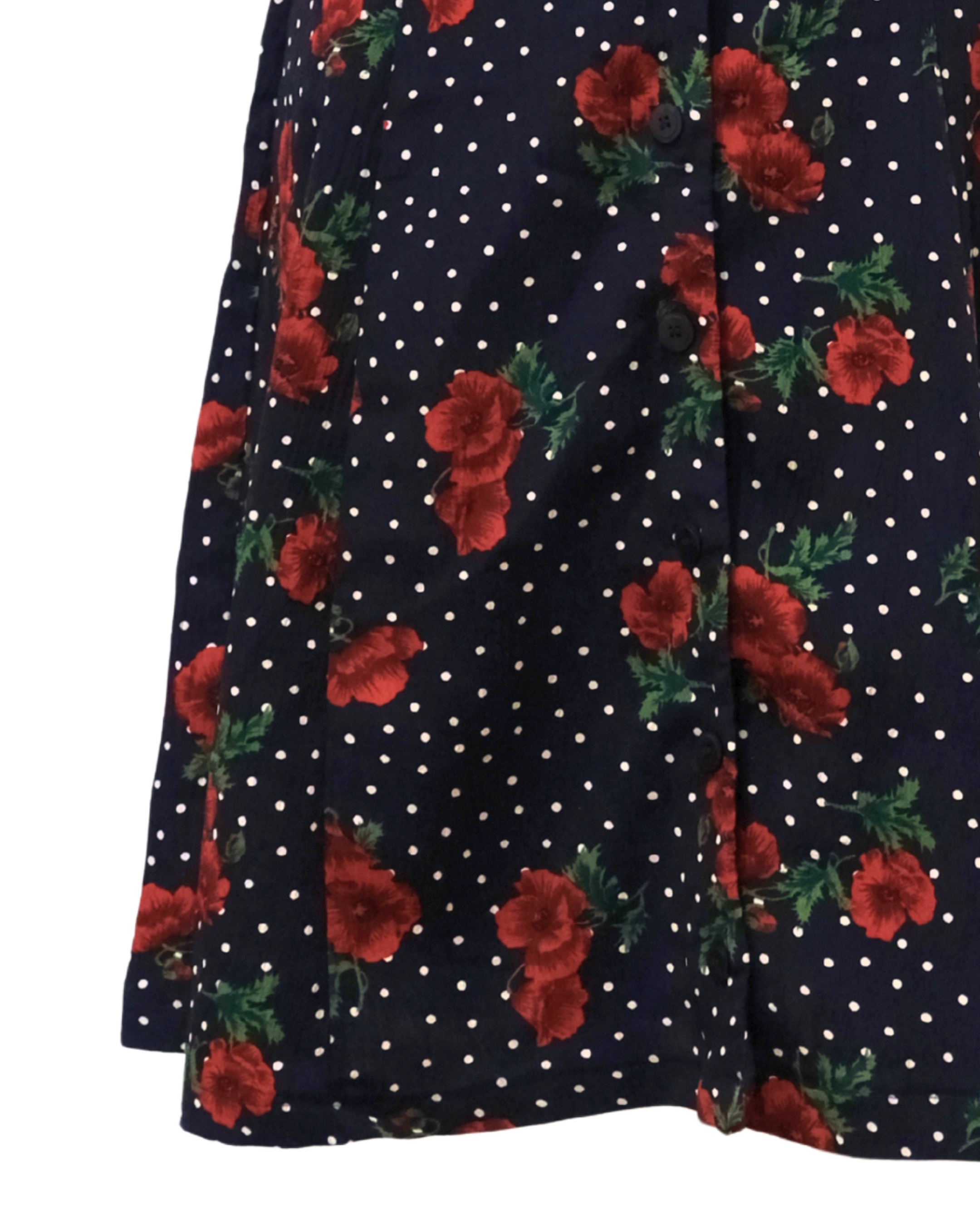 Navy blue fabric with red floral patterns and white polka dots