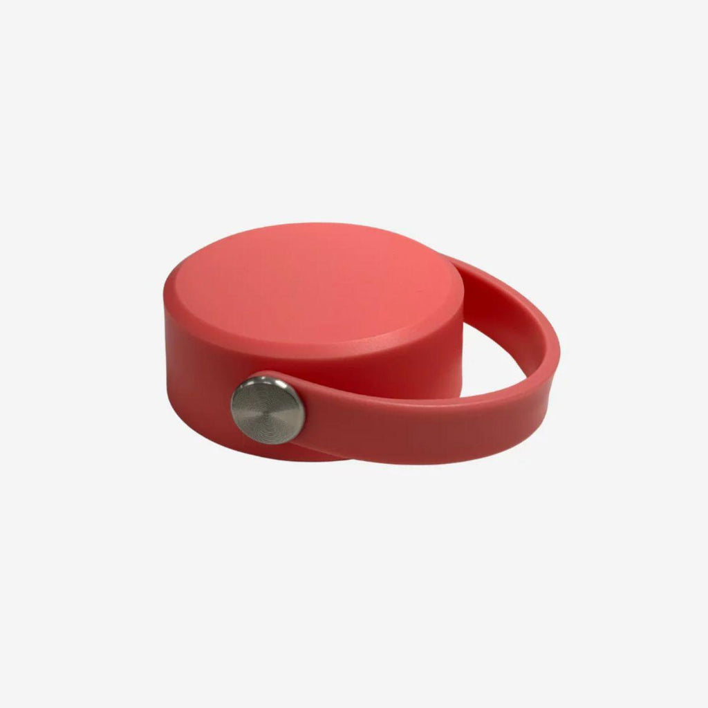 Pink drink bottle lid on a white background