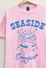 Pink t-shirt with blue 'Seaside Cowgirl' design featuring a mermaid on a hanger.