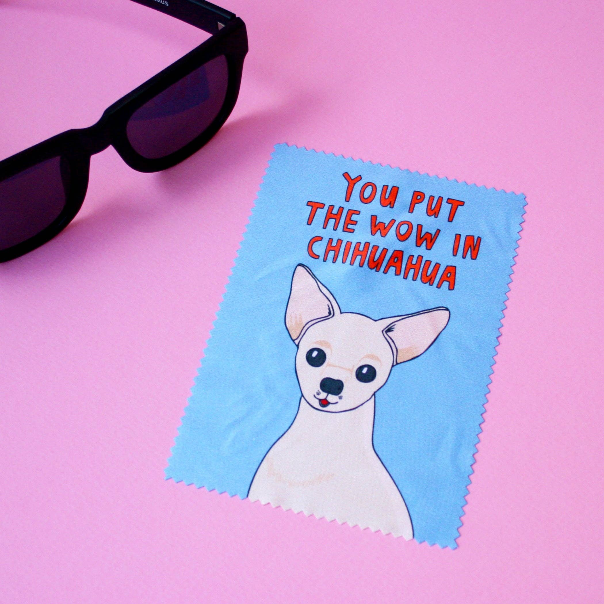 Cleaning cloth with a dog illustration and text on a pink background