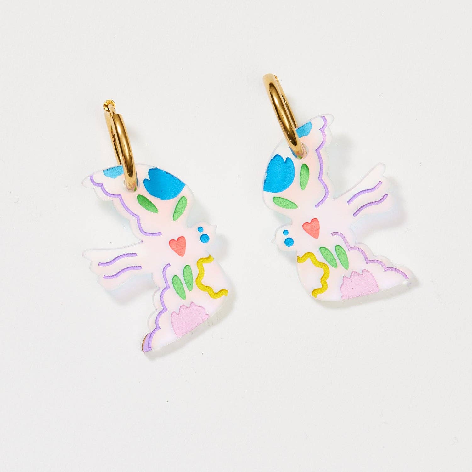 Pair of colorful butterfly-shaped earrings on a white background